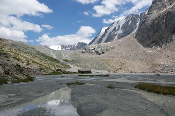 Scenery of Tian Shan Mountains during trekking in Altyn Arashan Valley to beautiful glacier....