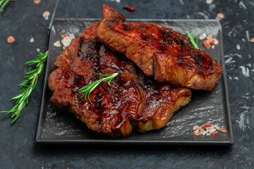 pork steak with herbs and spices on the grill pan, Restaurant menu, dieting, cookbook recipe place for text