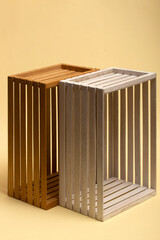 Multicolored boxes of wooden slats on a beige background