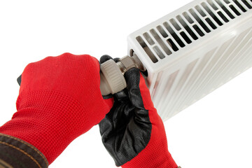 technician tightening central heating radiator fitting, close-up on isolated white