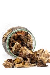 Dried mushrooms with jar, isolated on white background