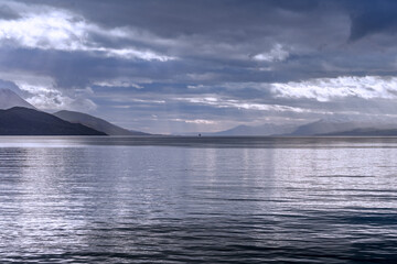 Fototapeta premium Small boat in the distance on the open sea