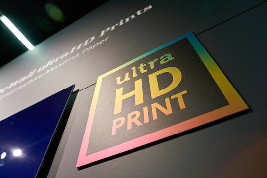 COLOGNE, GERMANY - CIRCA SEPTEMBER, 2018: close up shot of Ultra HD Print sign as seen at Photokina Exhibition. Photokina is a trade fair held in Europe for the photographic and imaging industries.