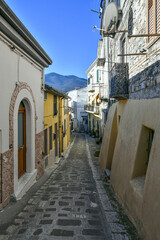 Fototapeta na wymiar A narrow street among the old houses of Rapolla, a village in the province of Potenza in Italy.