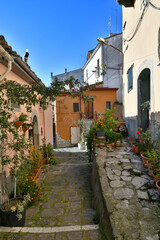 Fototapeta na wymiar A narrow street among the old houses of Rapolla, a village in the province of Potenza in Italy.