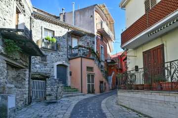 A narrow street among the old houses of Rapolla, a village in the province of Potenza in Italy.