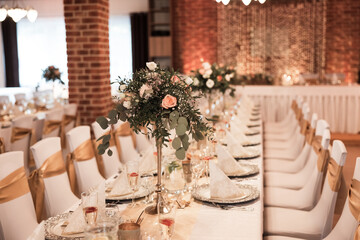 wedding table with decorations,flowers and food