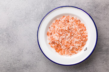 Pink himalayan salt in bowl. Top view.