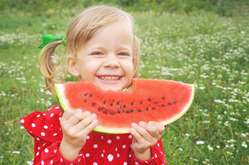 little child eating watermelon
