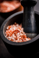 Pink himalayan salt in mortar.