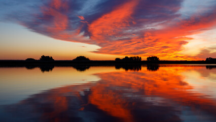 Sunrise with reflections in the Danube Delta in Romania