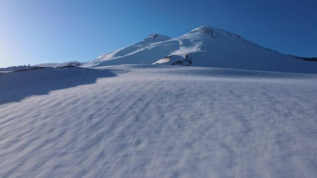 Aerial view of the two-headed Elbrus peak at dawn
