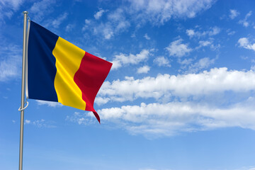 Republic of Chad Flag Over Blue Sky Background. 3D Illustration
