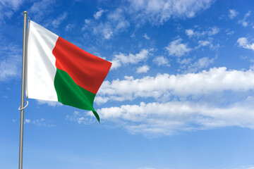 Republic of Madagascar Flag Over Blue Sky Background. 3D Illustration