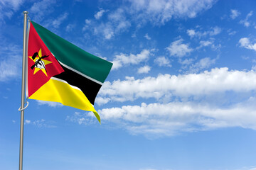 Republic of Mozambique Flag Over Blue Sky Background. 3D Illustration