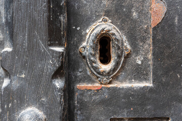 Old Door Lock. Close-up of an old door lock, ideal for backgrounds, vintage themes, detail themes.

