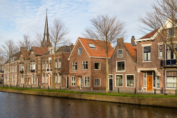 Fototapeta na wymiar Canal houses in the historic Dutch city of Weesp.