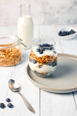 Homemade granola with nuts and fresh blueberries for breakfast. Healthy breakfast. Vegetarian food concept