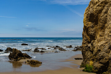 Fototapeta na wymiar El Matador Beach along the East Pacific Coast Highway in Malibu California. The beach is a collection cliff-foot beaches and bluff top view of the eroding formations, sea stacks, caves and arches. 
