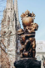 Fototapeta na wymiar Clermont Ferrand, France - 28.12.2022: Sculpture in the center of Clermont-Ferrand with the cathedral in the background