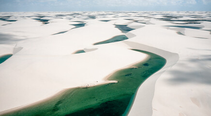 aerial view of white sand dunes of Lencois Maranhenses with blue water pools