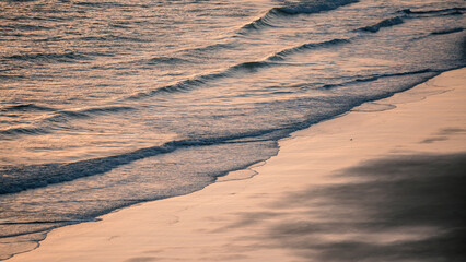 sand dunes and beach at sunrise in the morning