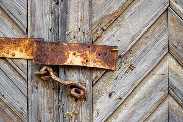 the old wooden door with rusty strength