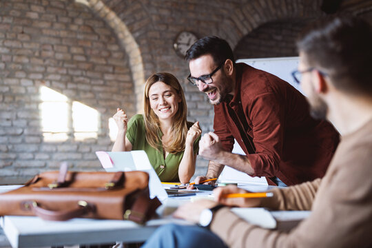 Group Of Smart People Working Together In Office