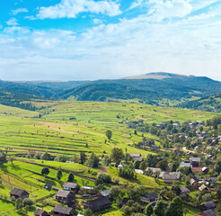 Beautiful summer mountain and village on mountainside (Carpathian. Ukraine)