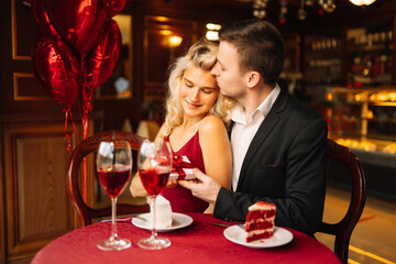Man presenting gift to his girlfriend.Valentine's day celebration. Relationship and love concept. 