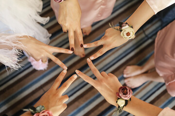 Bride and Bridesmaids Having Fun on Wedding Day