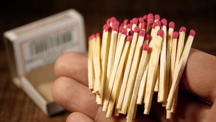 Accelerated shooting. One match burns out against the background of a wooden table. The texture of the tree. Match Flame