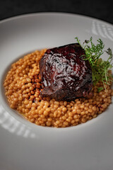 Delicious spanish food, dishes on a dark background in a restaurant, tasty looking dishes