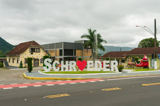 Schroeder, Brazil - Circa December 2022: Main square of Schroeder with Christmas decorations, historic memory center and city hall buildings in the background
