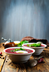 Traditional Ukrainian Russian borscht . Bowl of red beet root soup borsch with white cream . Beet Root delicious soup . Traditional Ukrainian food cuisine - 558489265