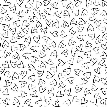 Seamless monochrome pattern with small hearts. Vector repeating texture. Repeatable backdrop with hand drawn black tiny hearts.