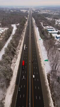Aerial shot over snow covered highway in Knoxville, Tennessee. Vertical 9x16 framing.
