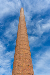 Old factory chimney in Malaga, Spain on October 10, 2022