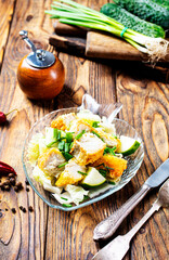 Fish dish - fried fish fillet with vegetables on glass plate