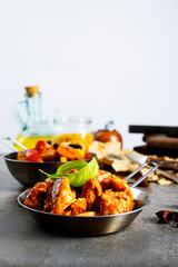 Thai beef stir-fry with pepper and basil on plate on a stone background with copy space. Top view, flat lay