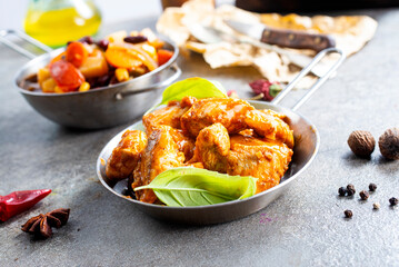 Thai beef stir-fry with pepper and basil on plate on a stone background with copy space. Top view, flat lay
