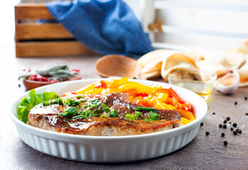 Grilled beef steak with rosemary in white plate