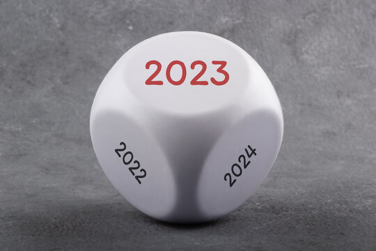 Game dice with the inscription 2022, 2023 and 2024. New year business concept.