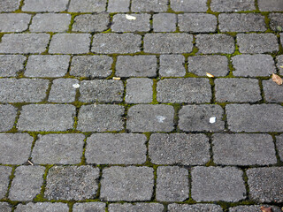 Stone surface of a walking path or road in town. Abstract texture for design purpose.