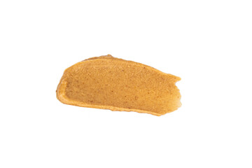 Fototapeta na wymiar Smears of delicious peanut butter on a white background. Isolated image.