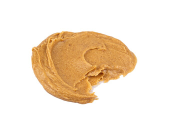 Smears of delicious peanut butter on a white background. Isolated image.