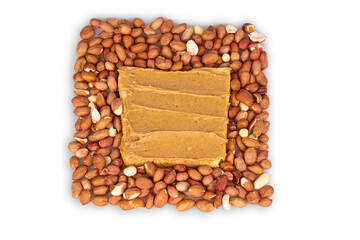 A square sandwich with peanut butter on a background of scattered peanuts. Tasty breakfast. Healthy food concept.