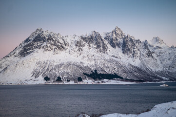Lofoten islands, Norway. Nothen light, mountains and frozen ocean. Winter landscape at the sunset. Norway travel - image. nordic sea. Fjords
