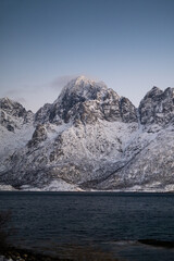 Lofoten islands, Norway. Nothen light, mountains and frozen ocean. Winter landscape at the night time. Norway travel - image. 