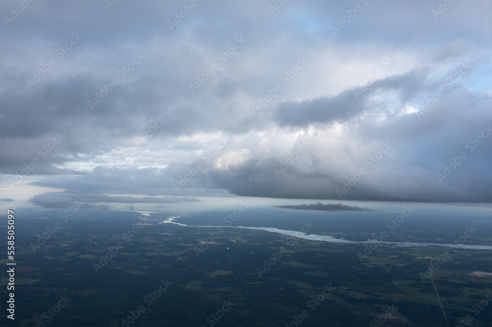 Aufkleber a view of a cloudy sky over a river and land area from an airplane window with a view of the sky and